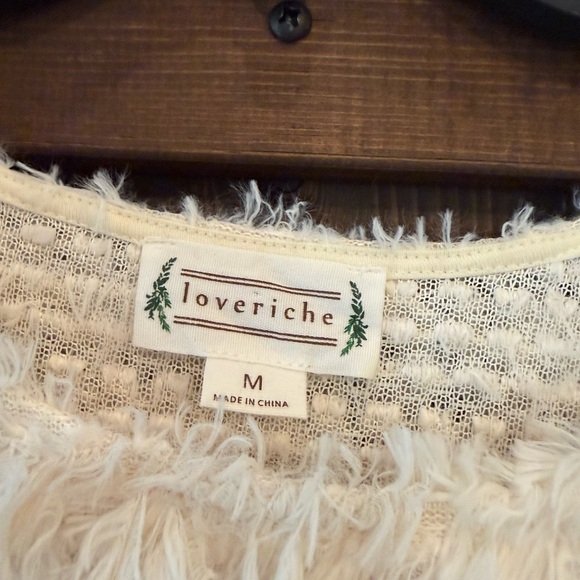 Love Richie Sweater has a shaggy or fuzzy texture and is a cream color. Size M - Picture 4 of 9